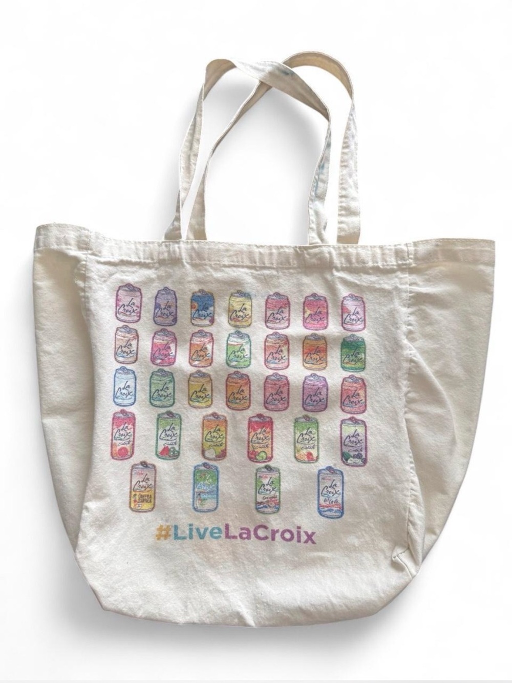 LA CROIX roomy tote bag with colorful designs. Some ink spots on handles